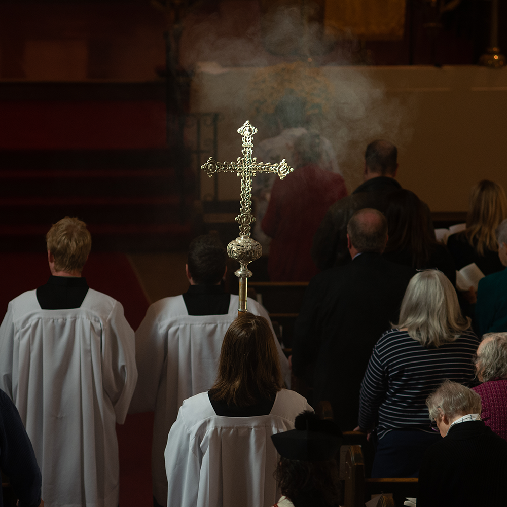 Crucifix in morning light during a procession