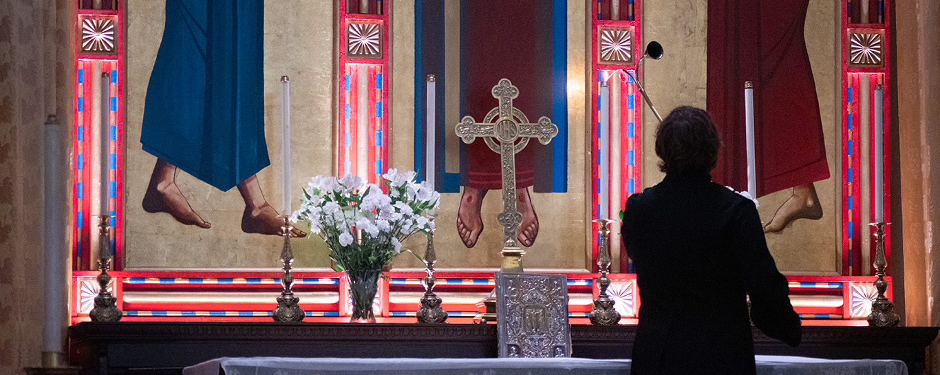 A server lighting candles