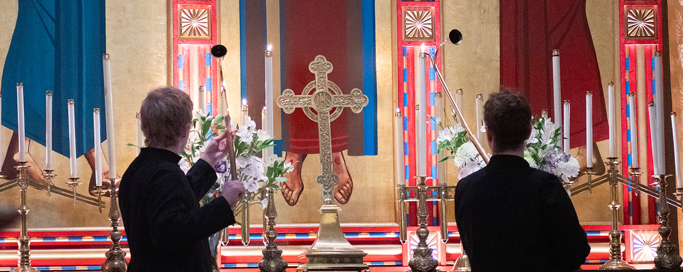 Servers lighting candles