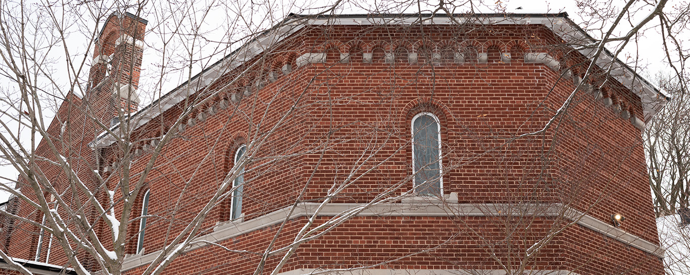 Bare snowy trees and the church exterior