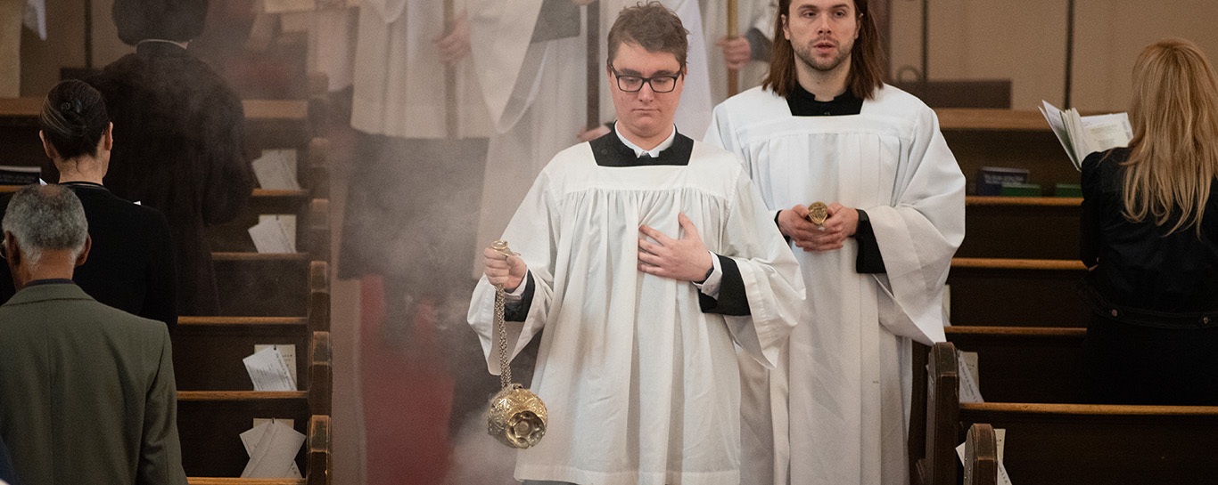 A thurifer and boat man in procession