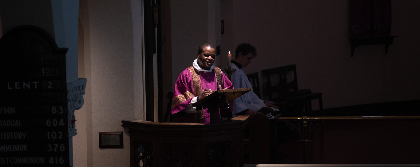 Fr Kwari preaching from the pulpit
