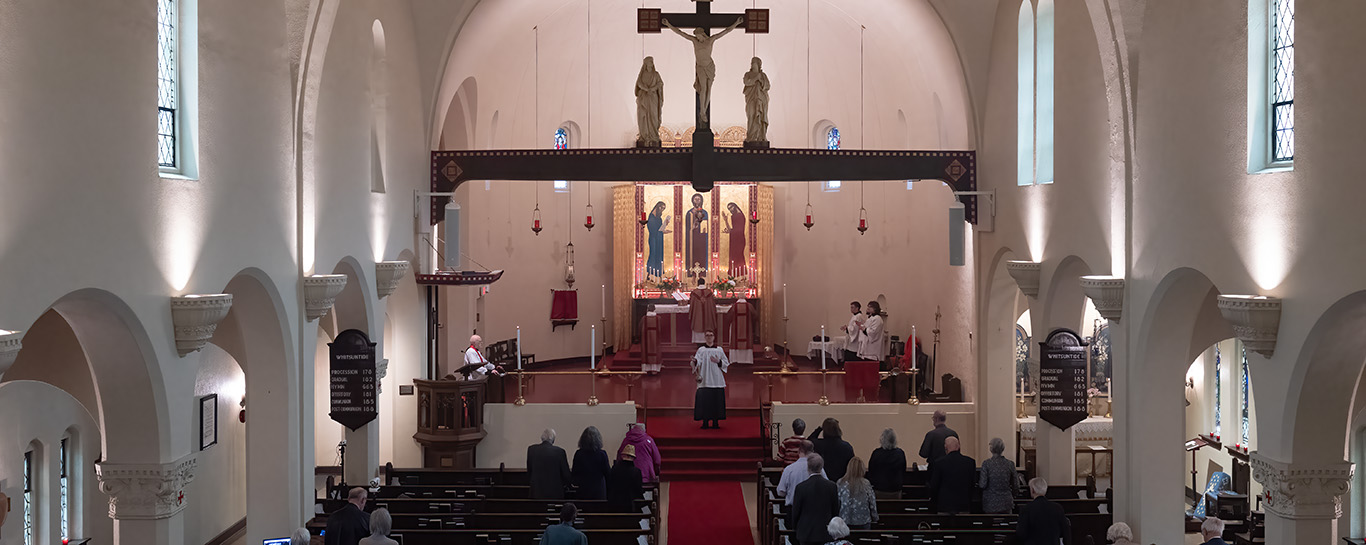 A server censes the congregation with incense. 