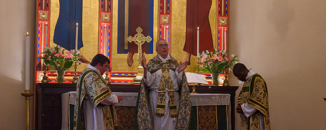 Fr Don Tudin gives the mass intentions before the celebration of the Eucharist.