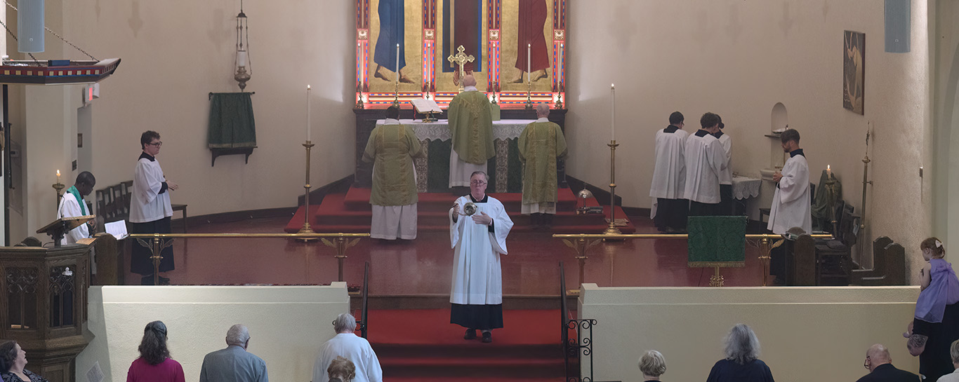 A server censing the congregation during Trinity XIII