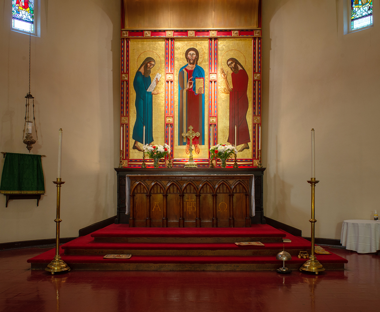 Altar during summer Ordinary Time, showing bare wood without a cloth frontal.