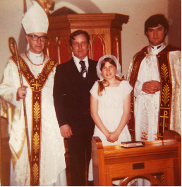 Fr Young as a young priest beside a marriage couple.