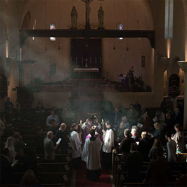 Gospel reading in beam of sunlight