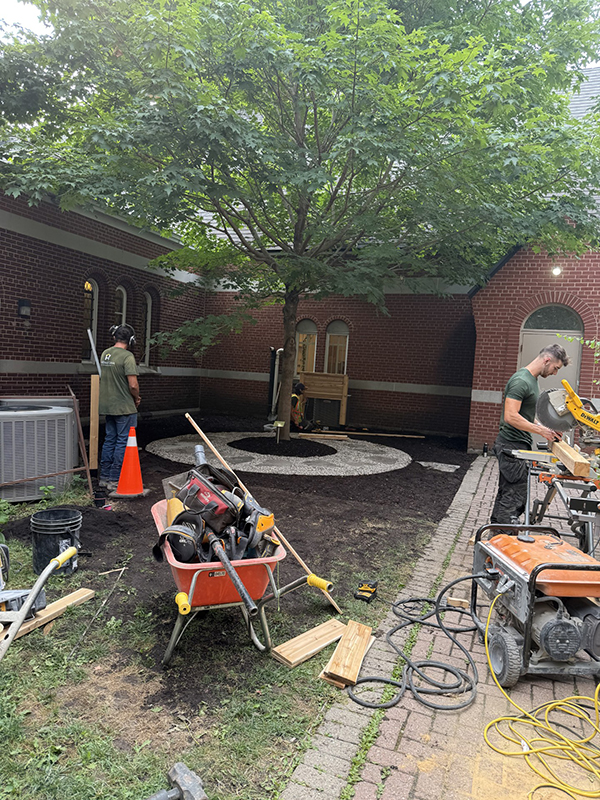 Workers preparing the landscaping.