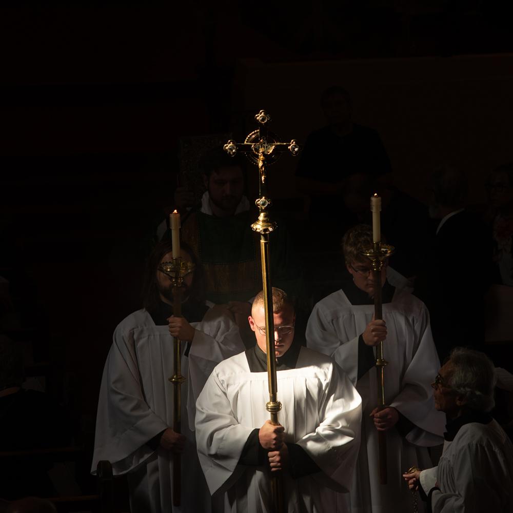 Crucifer holding the Crucifix during a Gospel Procession