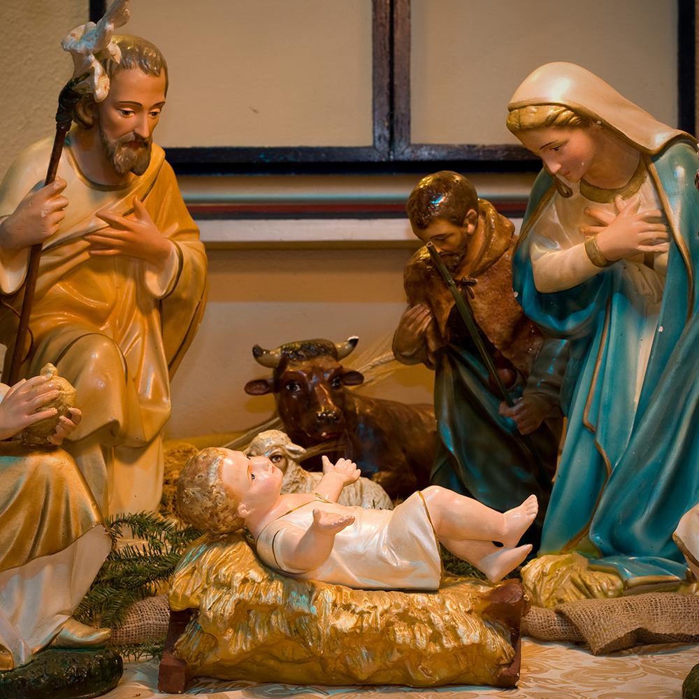 The crèche: small painted statues of Joseph, Mary and the baby Jesus.